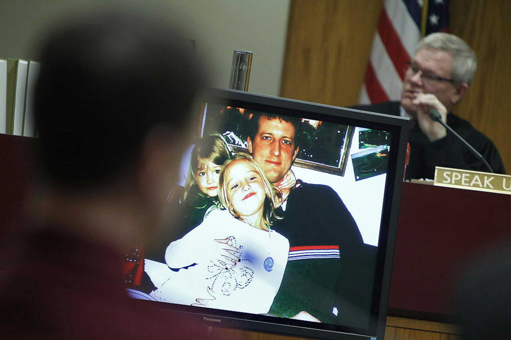 Judge Howard Cameron and Aaron Schaffhausen were shown pictures of earlier days at the Schaffhausen home during the fifth day of trial at a St. Croix County courtroom in Hudson, Wis., on Monday.