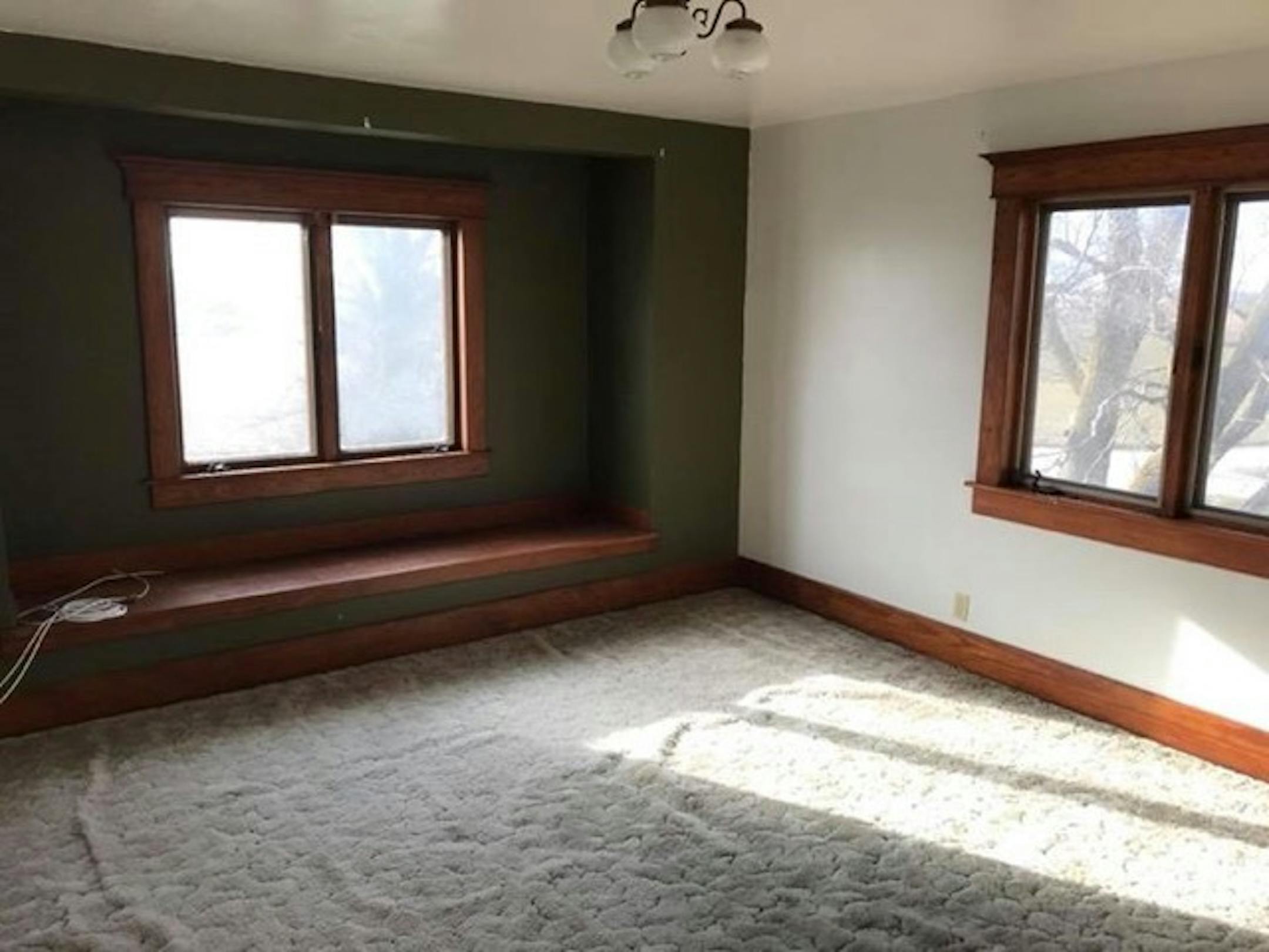 This Iowa farmhouse's owners restored the woodwork to its early 20th-century grandeur. They offered the house for free on Craigslist, and found a Minnesota taker. Courtesy Roger Dolecheck