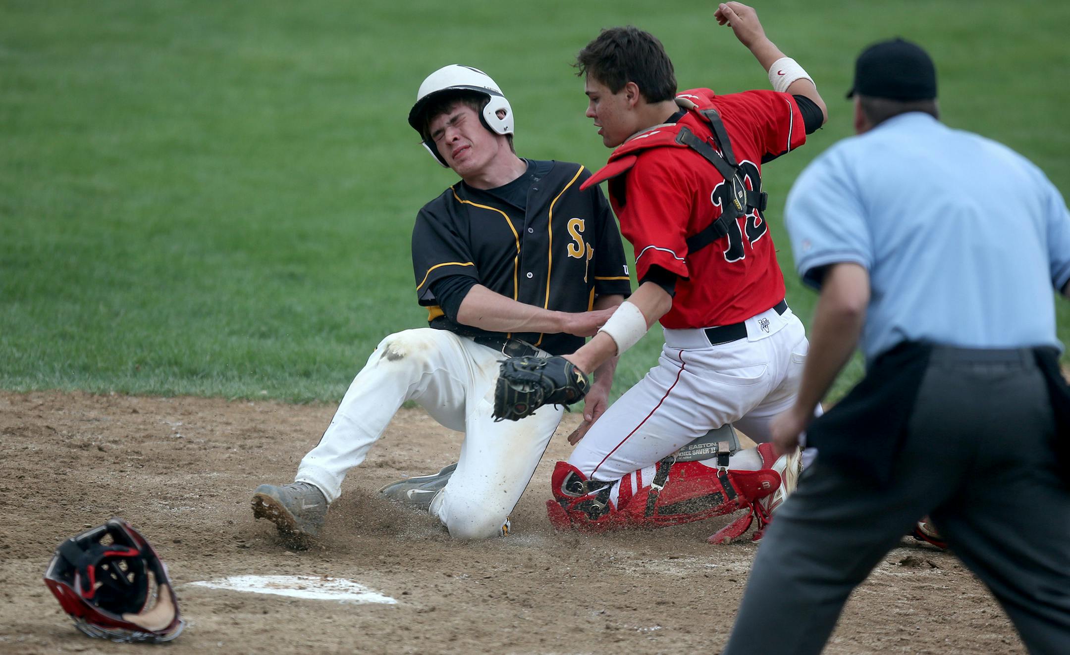 Belle Plaine's Aiden Ladd tagged out Sibley East's Zac Weber at home plate. ] (KYNDELL HARKNESS/STAR TRIBUNE) kyndell.harkness@startribune.com Belle Plaine vs Sibley East in Arlington Min., Friday, May 15, 2015.
