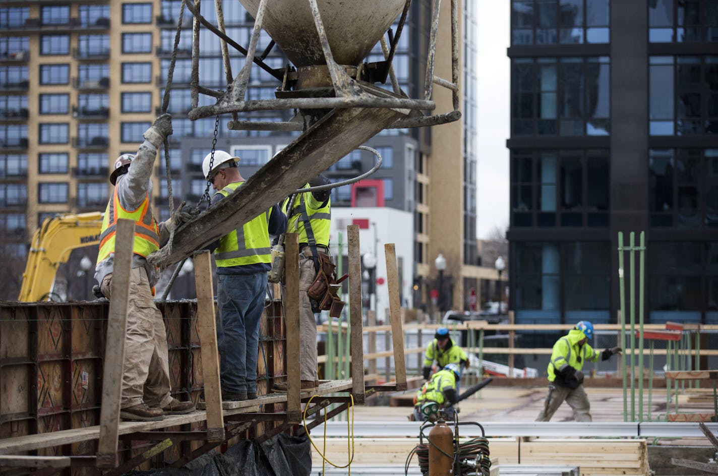 Minnesota had a strong job report for November, with construction leading the way by adding 3,300 seasonally-adjusted jobs. Here, construction is underway at the Encore Apartments in downtown Minneapolis. ] Brian.Peterson@startribune.com Minneapolis, MN - 12/17/2015