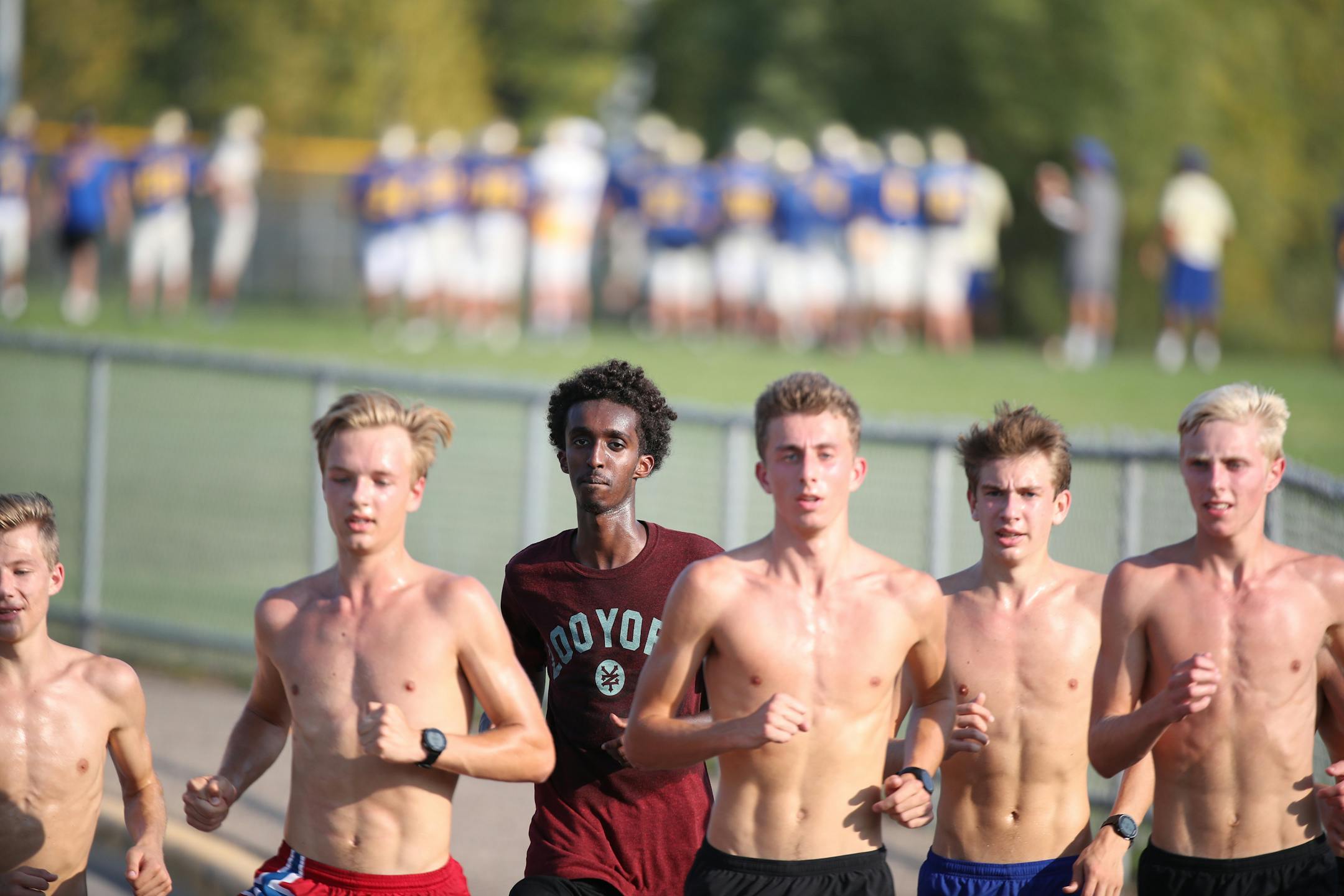 Khalid Hussein center (with shirt on) and Grant Price (far right ) and other members of the Wayzata high cross county team worked out at Wayzata High School Tuesday September 12,2017 in Plymouth, MN. ] JERRY HOLT � jerry.holt@startribune.com ORG XMIT: MIN1709130608461930