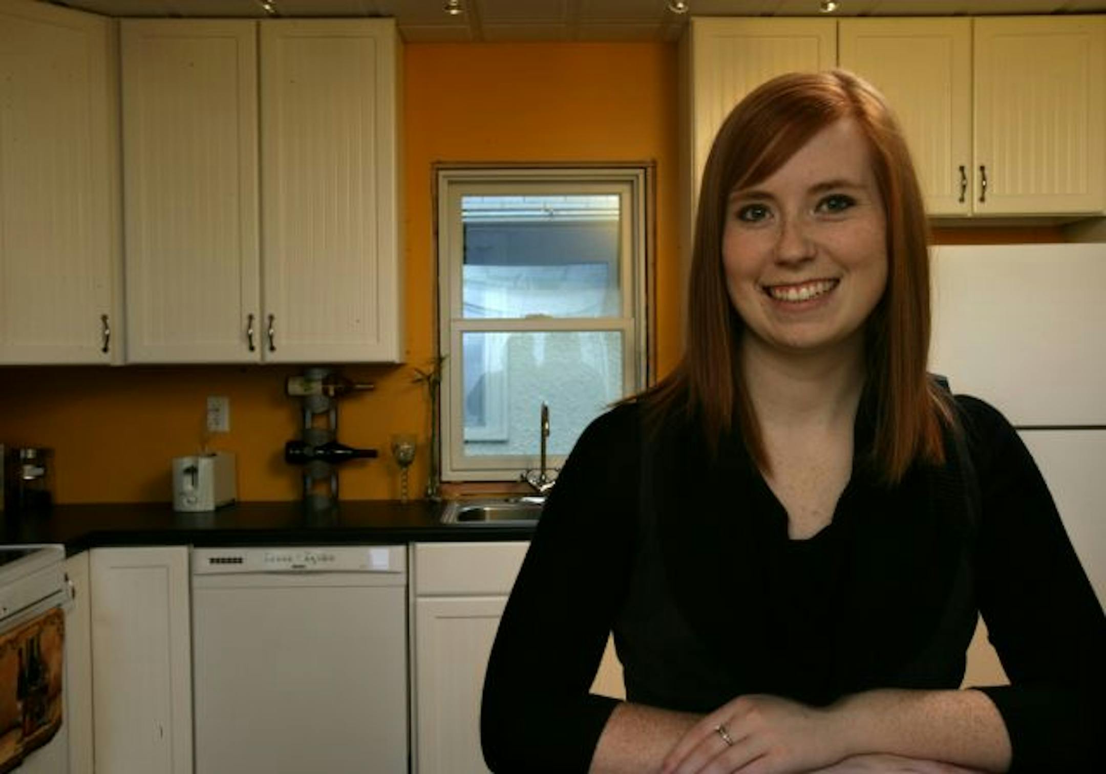 Jeanna Sabers bought a foreclosed two-bedroom house in Minneapolis and took out a rehab purchase loan to redo the kitchen and make other necessary repairs. The kitchen is done, but she's still painting the dining room, below, and working on other projects.