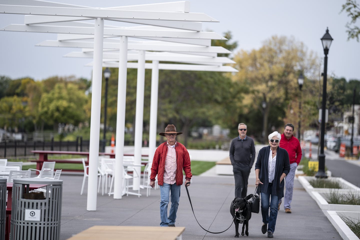 Michael and Carol Allen of Plymouth walked along Wayzata's new lakeside plaza with their dog Tug. The couple was out walking to celebrate Carl's birthday.] Jerry Holt •Jerry.Holt@startribune.com Wayzata's new lakeside plaza is almost complete September 17,2020 in Wayzata,MN.