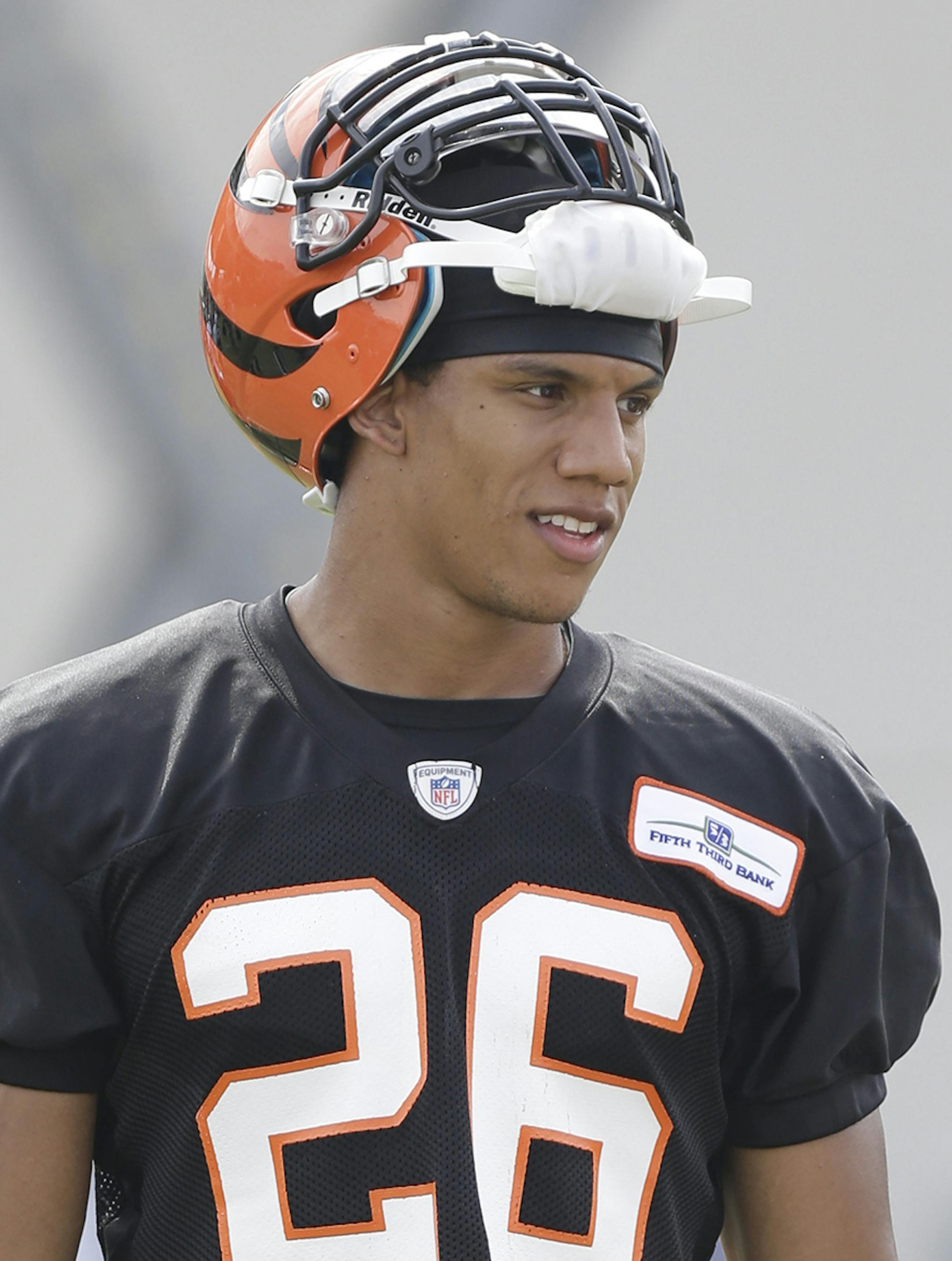 Cincinnati Bengals safety Taylor Mays takes a break during practice at the NFL football team's training camp, Friday, July 26, 2013, in Cincinnati. (AP Photo/Al Behrman) ORG XMIT: OHAB101
