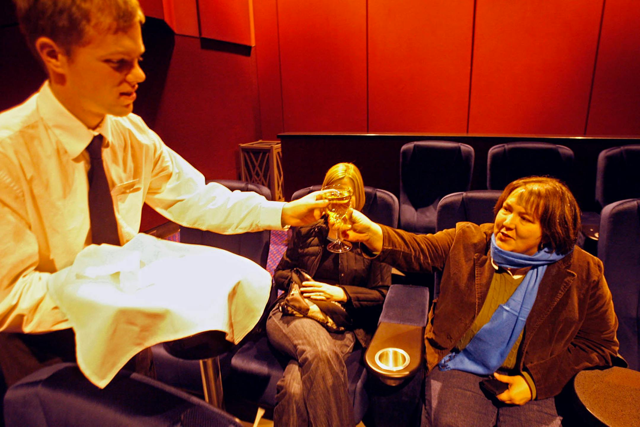 VIP at the MOA: Jeffrey Leppert delivered a glass of white wine to Katherine Debertin of Minneapolis at the Mall of America's new VIP screening room.