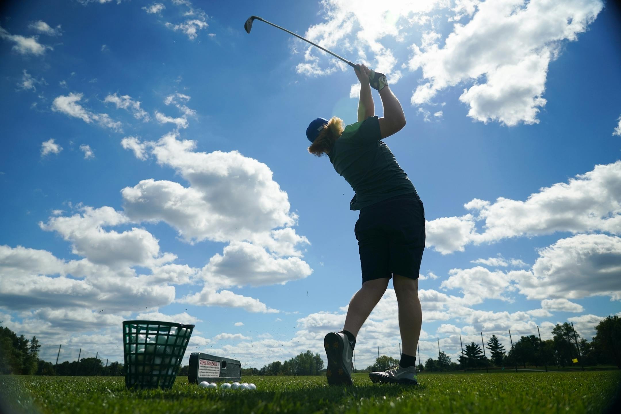 Cal Rivard, a student at UMD, took some time to practice hitting at the Keller Golf Course driving range in Maplewood.