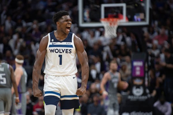 Minnesota Timberwolves guard Anthony Edwards reacts to a score as the Sacramento Kings ask for a timeout during the second half in an NBA basketball g