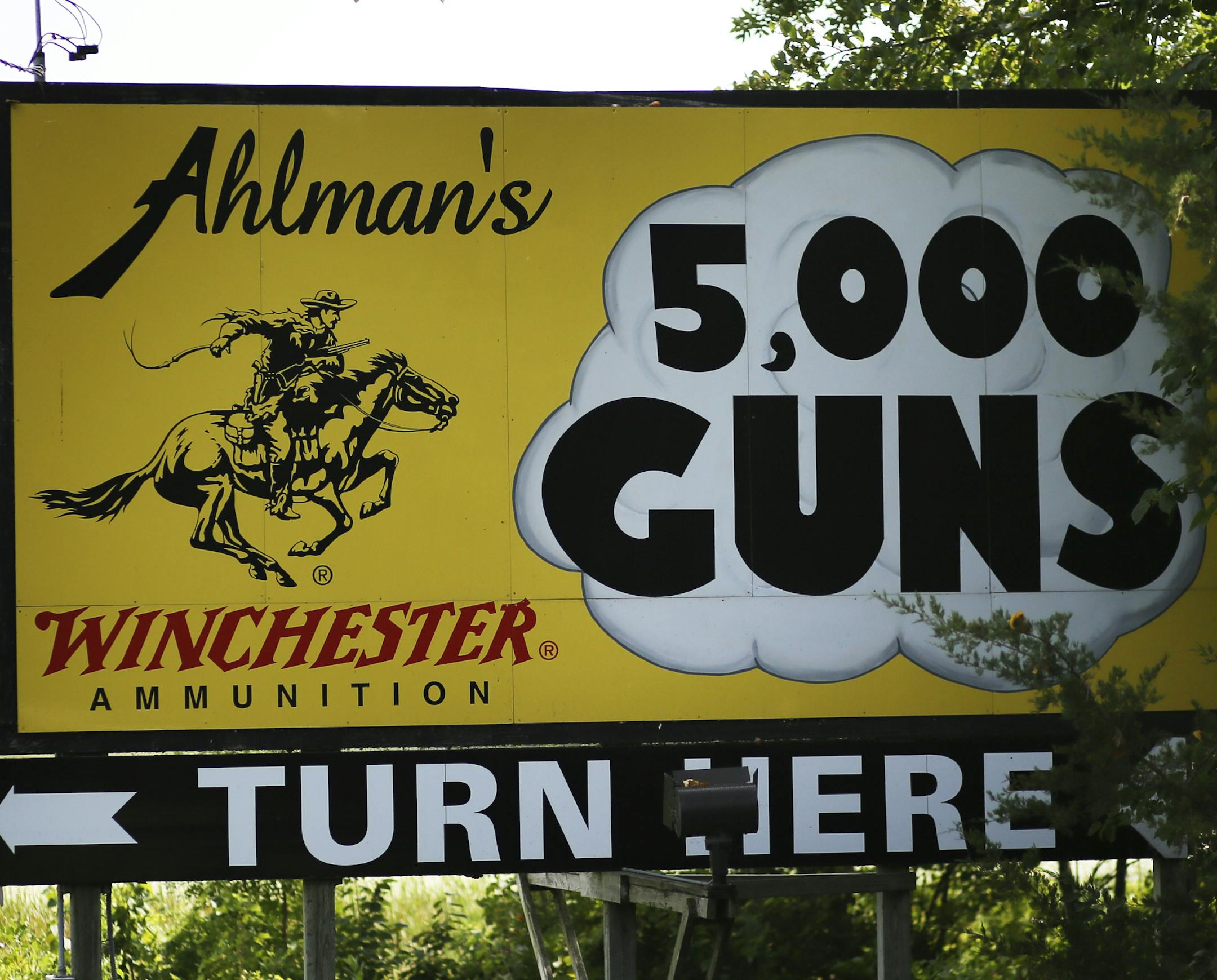 A sign for Ahlman's in Morristown, pointing shooters and gun aficionados to the "Shooter's Round Up," at Ahlman's Gun Shop.](DAVID JOLES/STARTRIBUNE) djoles@startribune.com Ahlman's Gun Shop of Morristown in southern Minnesota has their big gun blowout know as "Shooter's Round Up" this weekend. Cannons, tanks, machine guns, sporting arms: all of it is shot by the thousands who attend.