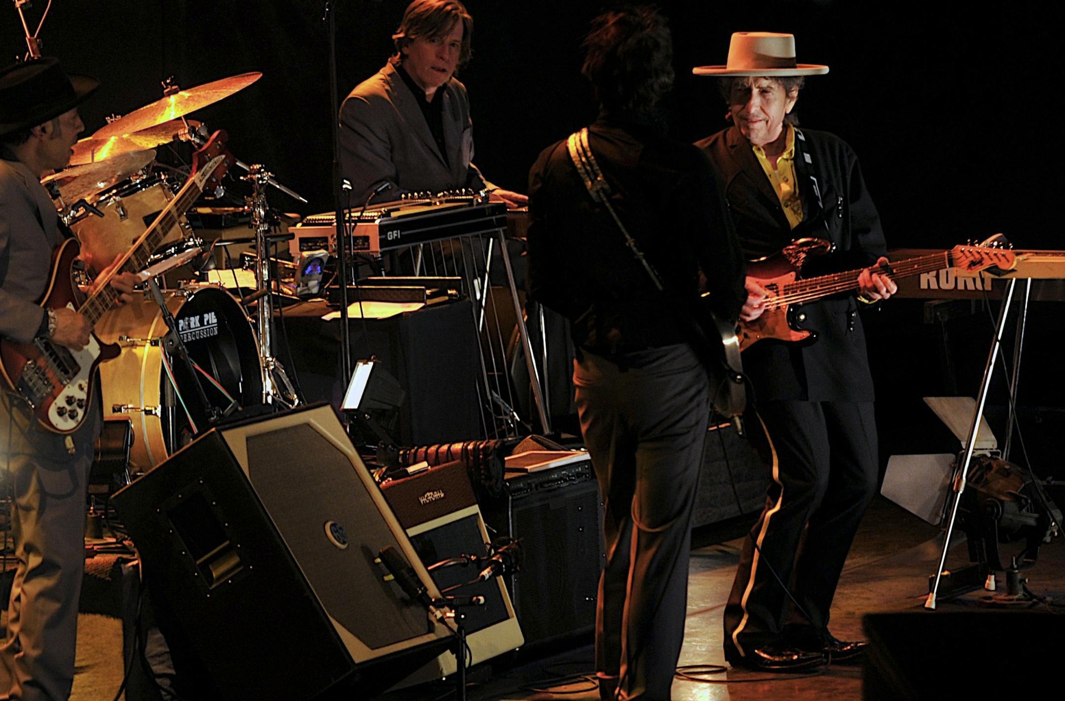 American folk icon Bob Dylan, right, performs with his band in Beijing, China.