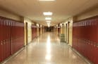Empty School Hallway with Student Lockers Children who need school as a safe space will suffer during this pandemic.