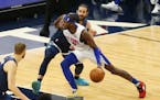 Detroit Pistons forward Jerami Grant (9) drives on Minnesota Timberwolves guard Ricky Rubio during the first quarter of an NBA basketball game, Wednes