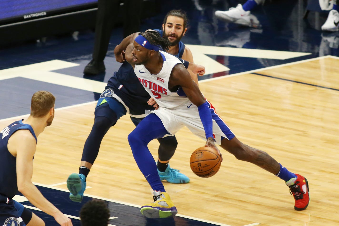 Detroit Pistons forward Jerami Grant (9) drives on Minnesota Timberwolves guard Ricky Rubio during the first quarter of an NBA basketball game, Wednesday, Dec. 23, 2020, in Minneapolis. (AP Photo/Andy Clayton-King)