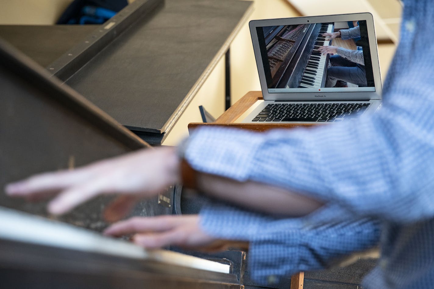 Nicholas Susi, Assistant Professor of Music, at the College of St. Scholastica, demonstrated his process of recording playing piano on his MacBook. Those videos will then be posted online for students to watch and learn from. ]
ALEX KORMANN &#x2022; alex.kormann@startribune.com The College of St. Scholastica professors have been preparing for teaching their classes online which has unique challenges for different departments such as science and music.