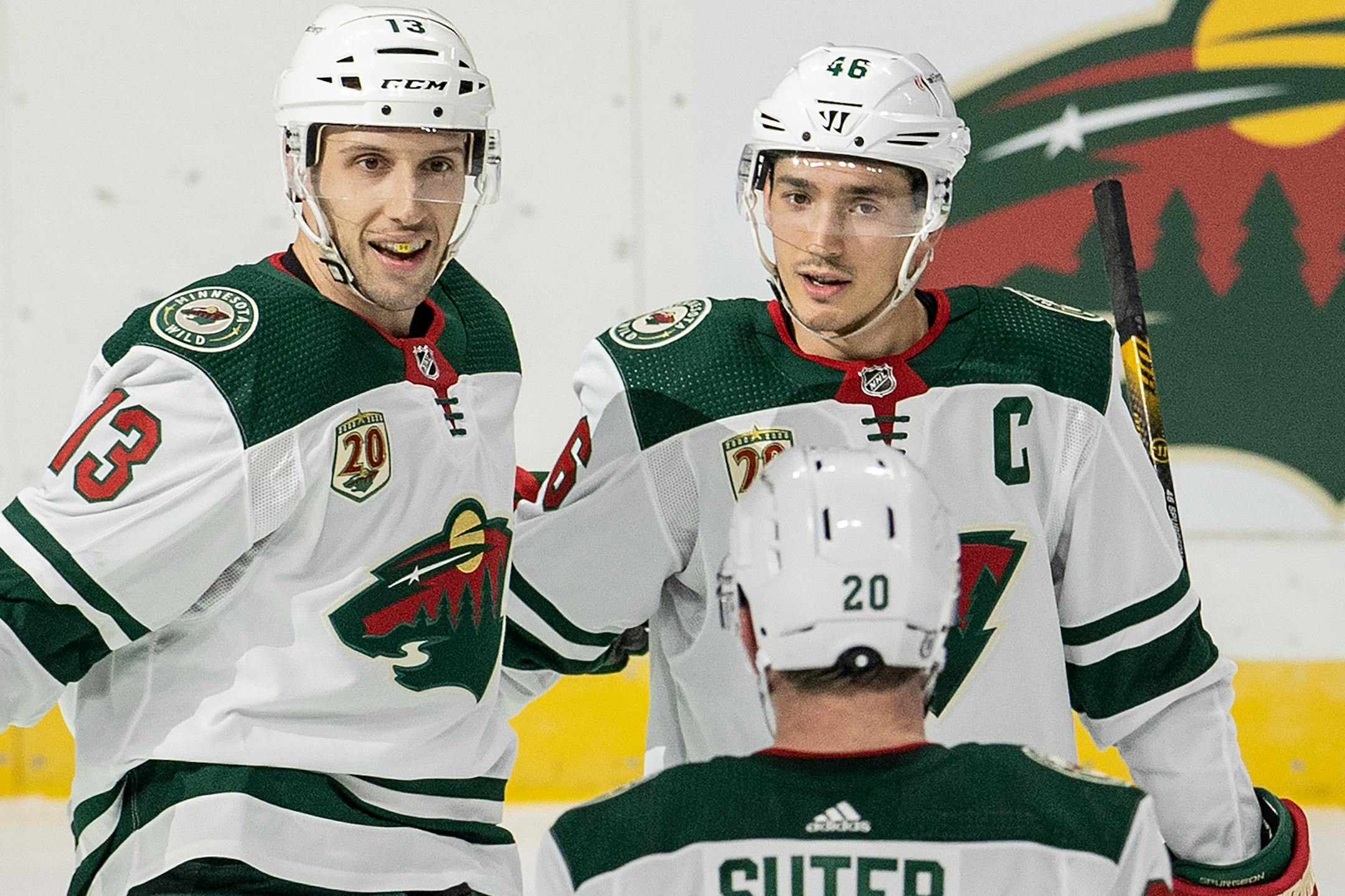 Nick Bonino (13) and Jared Spurgeon (46) of the Minnesota Wild celebrated a Spurgeon in the third period.