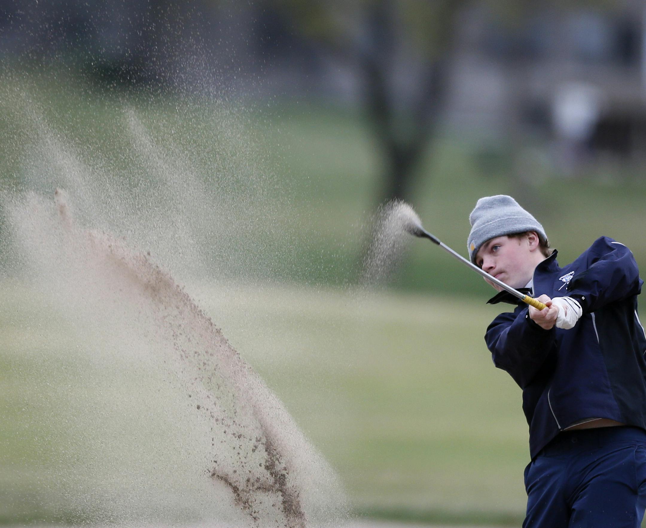 Ben Frazzini of Wayzata shoots out of a sand trap while playing in the Tri-State invitational at Edinburgh USA Golf course April 24, 2015 in Brooklyn Park, Minnesota.] Jerry Holt/ Jerry.Holt@Startribune.com