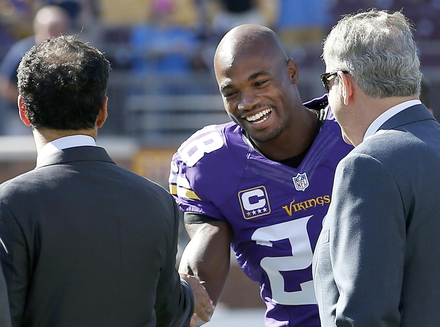 Minnesota Vikings president Mark Wilf and owner Zygi Wilf greeted running back Adrian Peterson (28) during pregame warm ups at TCF Bank Stadium before the Vikings vs. Lions game. ] CARLOS GONZALEZ &#xef; cgonzalez@startribune.com - September 27, 2015, TCF Bank Stadium, Minneapolis, MN, NFL, Minnesota Vikings vs. San Diego Chargers ORG XMIT: MIN1509301540474903