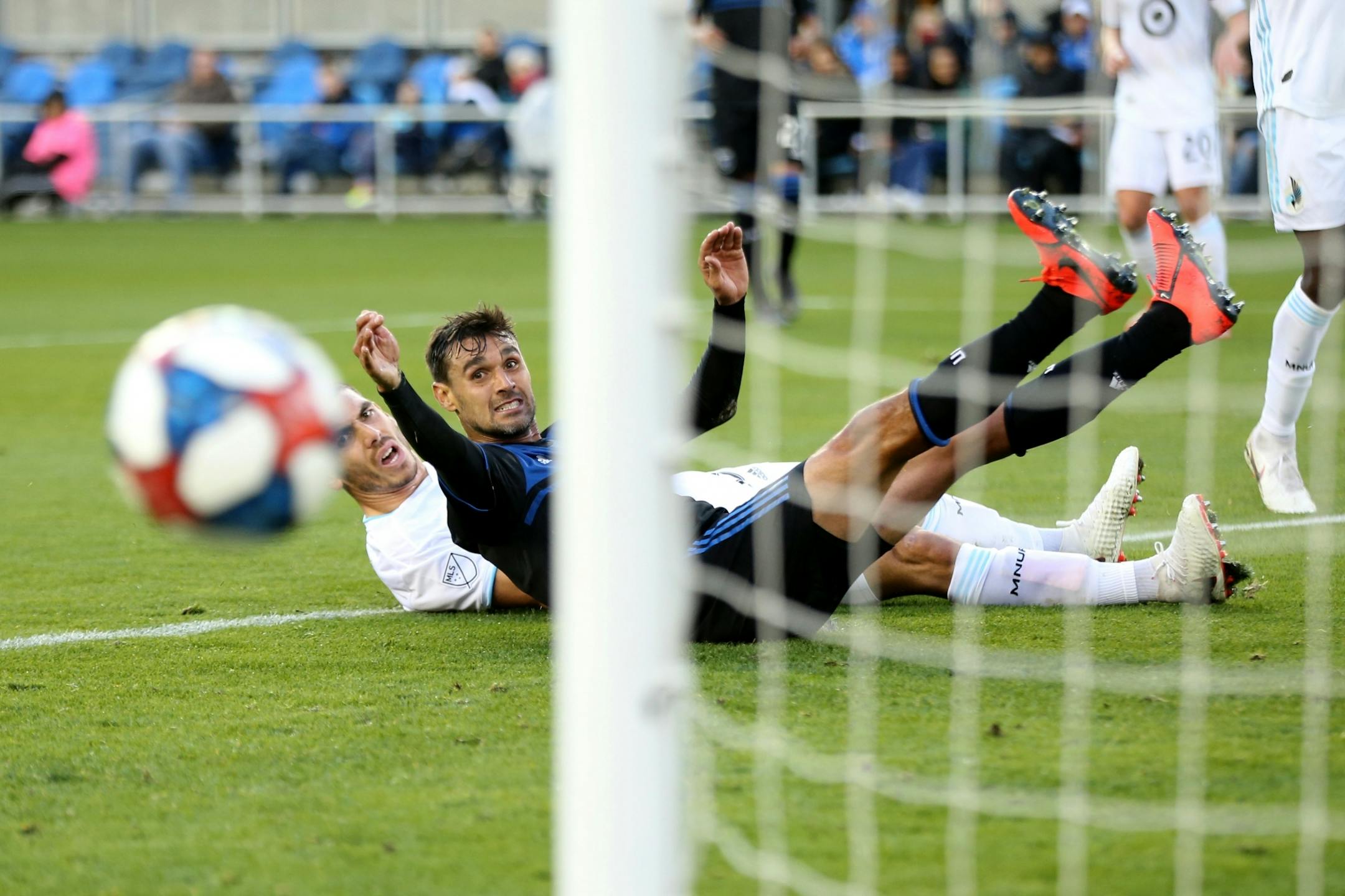 SAN JOSE, CALIFORNIA - MARCH 9: San Jose Earthquakes' Chris Wondolowski (8) attempts to score against Minnesota United's Michael Boxall (15) during the first half of a MLB game at Avaya Stadium in San Jose, Calif., on Saturday, March 9, 2019.