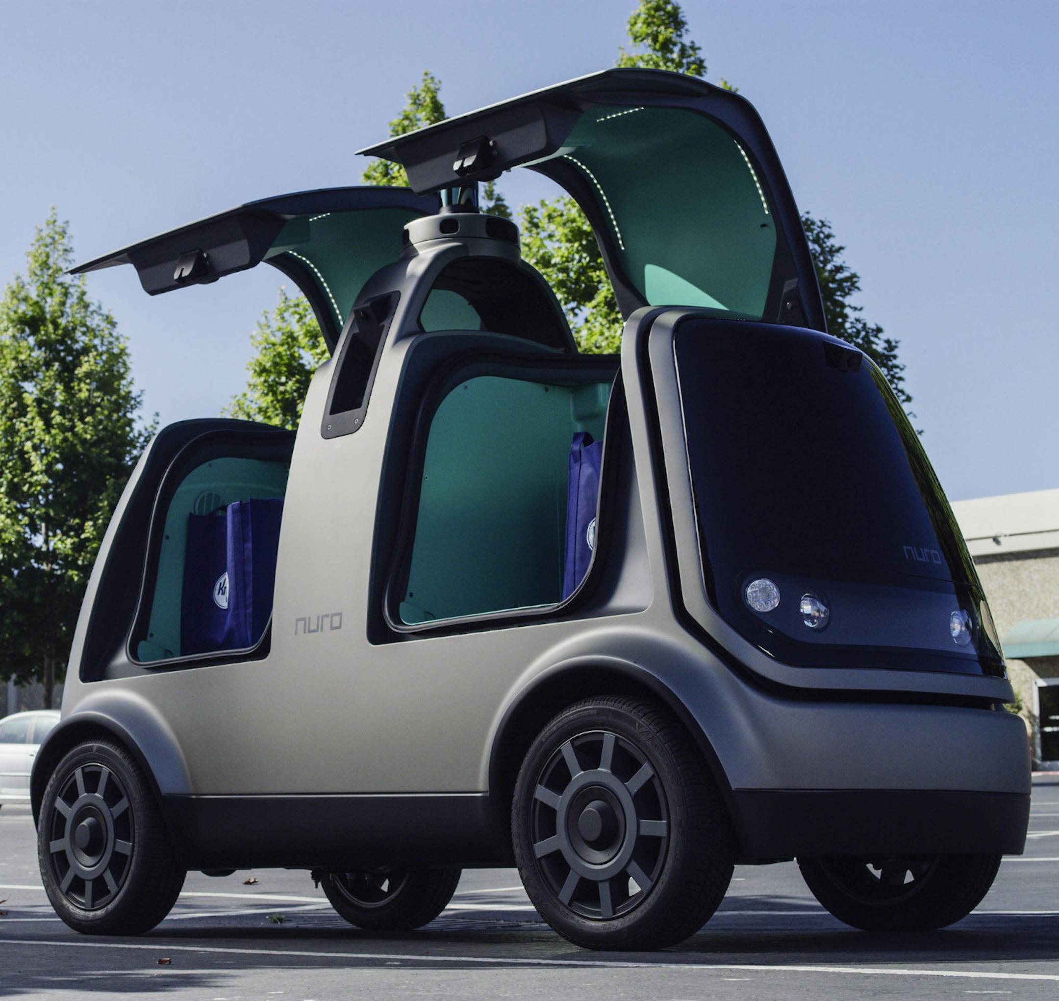 This undated image provided by The Kroger Co. shows an autonomous vehicle called the R1. Nuro and grocery chain Kroger are teaming up to bring unmanned delivery service to customers. The companies said Tuesday, Dec. 18, 2018, that Nuro's unmanned vehicle, the R1, will be added to a fleet of autonomous Prius vehicles that have run self-driving grocery delivery service in Scottsdale, Ariz., with vehicle operators since August. (Andrew Brown/The Kroger Co. via AP) ORG XMIT: NYAG603