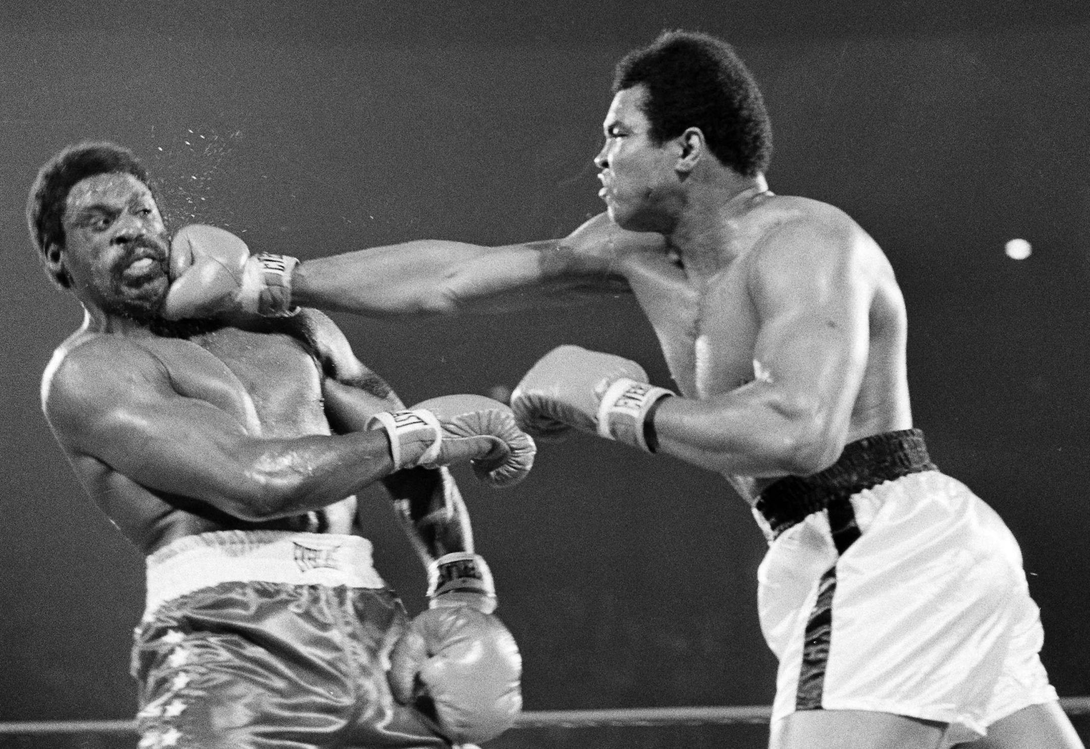 FILE - In this May 16, 1975, file photo, Muhammad Ali hits Ron Lyle, left, with a hard right to the chin during fifth round action of the title bout in Las Vegas. Lyle, who fought Muhammad Ali for the title in 1975 and later battled George Foreman, died Saturday, Nov. 26, 2011, in Denver, a Salvation Army official said. He was 70. (AP Photo/File