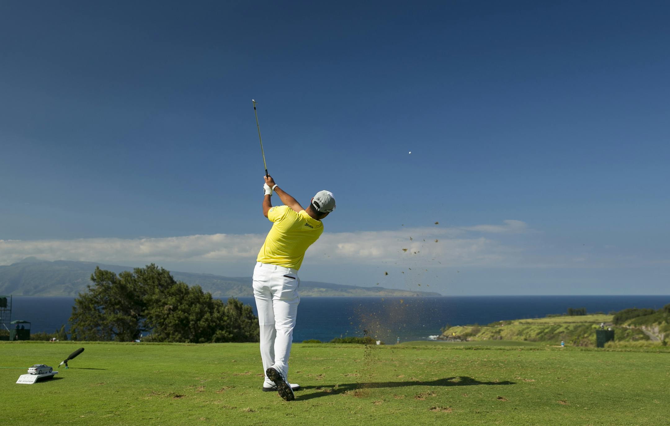 Hideki Matsuyama, of Japan, tees off on the 11th tee box during the third round of the Tournament of Champions golf tournament, Sunday, Jan. 11, 2015, in Kapalua, Hawaii. (AP Photo/Marco Garcia)