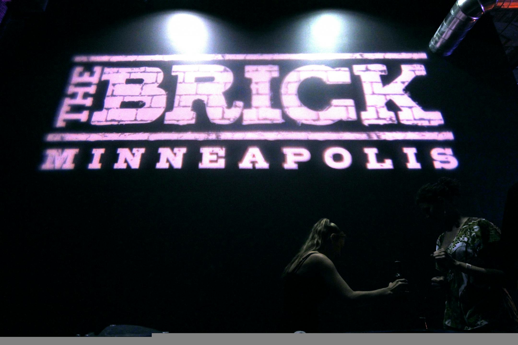 Stacie Schaeffler served beers at The Brick in Minneapolis on Monday.