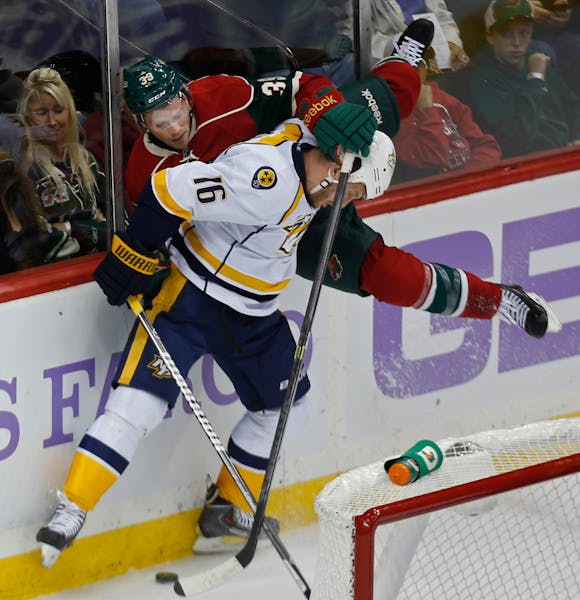 The Predators' Rich Clune pinned Wild defenseman Nate Prosser against the boards during Minnesota's 2-0 victory.