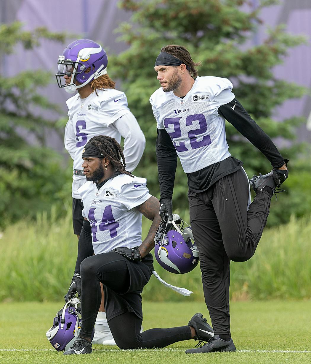 Vikings safeties Lewis Cine, left, Josh Metellus, center, and Harrison Smith during a team workout in May. 