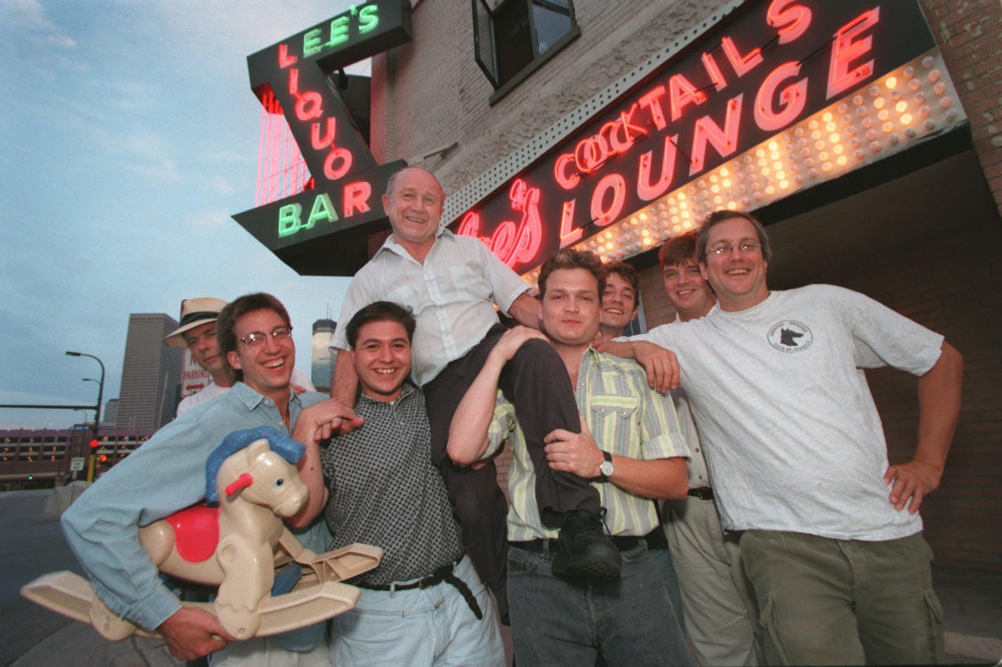 Lee&#xed;s Lounge, downtown Mpls -- Members of local band, Trailer Trash, held up Lee&#xed;s Lounge owner Louis Sirian Sr. on their shoulders as they stood infront of the downtown Mpls bar. The band has played at the bar for the past three years. Also helping hold up Sirian, was his son Louis Sirian Jr. (third from left.)