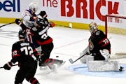 Ottawa goalie Joonas Korpisalo gets some help in front during his team's victory over Edmonton on March 24.