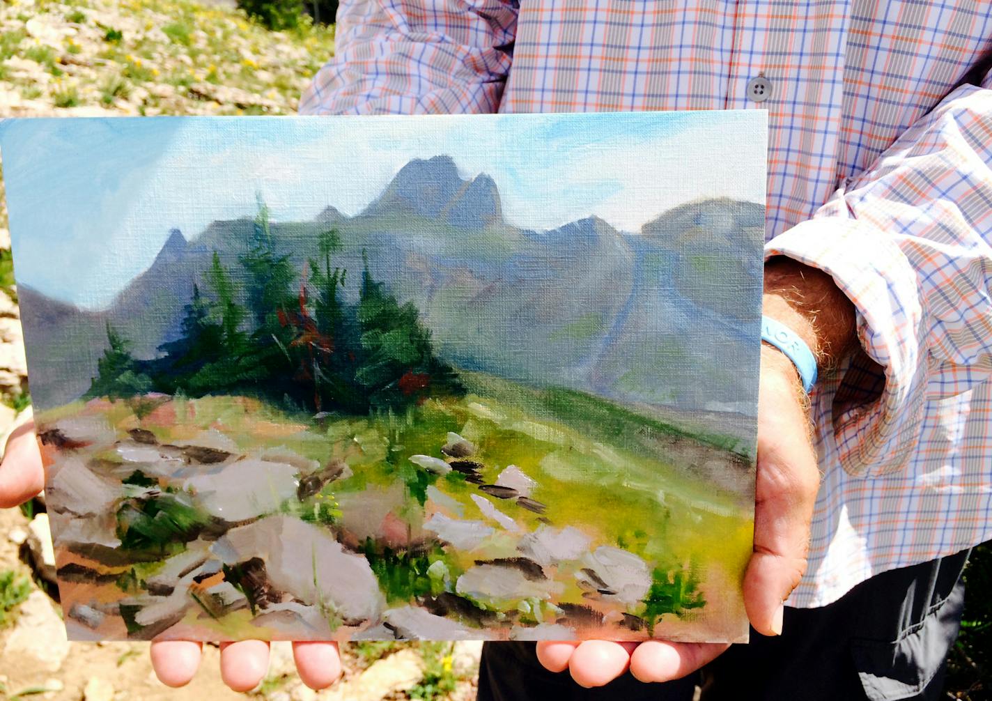 Margie Brackin painting the Grand Tetons on a trip out of Driggs , ID