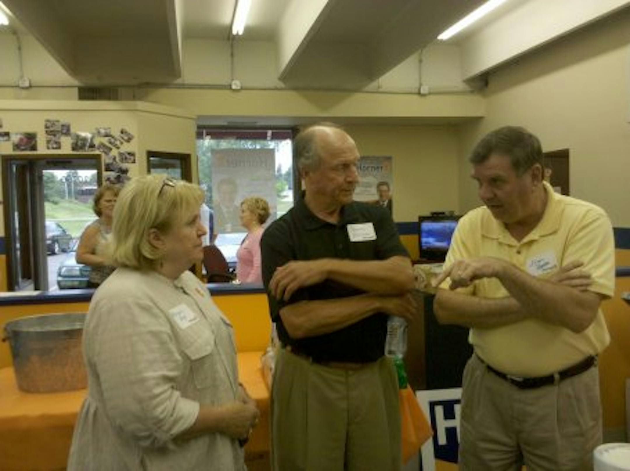 George Horner (middle) stands with other supporters of IP candidate Tom Horner.