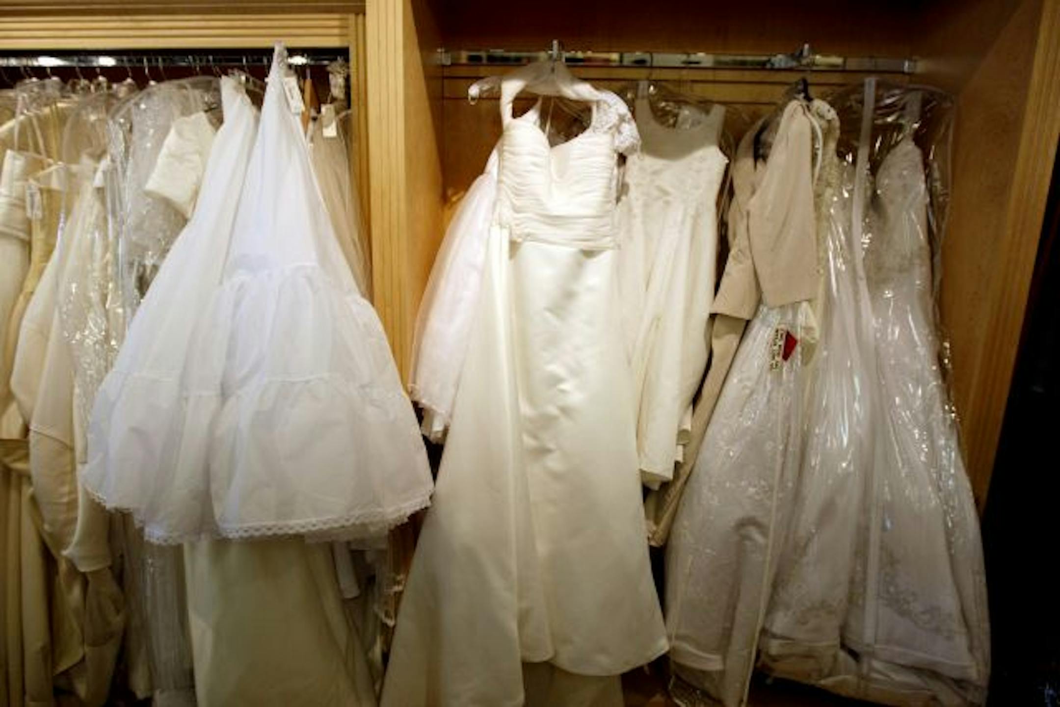 A rack of wedding dresses at Second Debut in St. Louis Park.