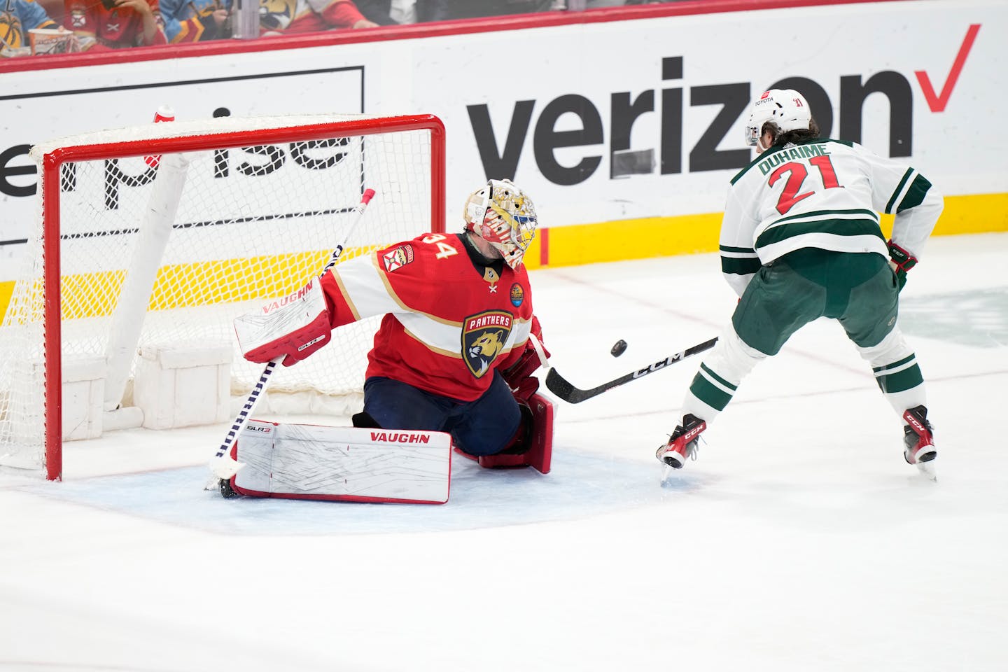 Minnesota Wild right wing Brandon Duhaime (21) attempts a shot at Florida Panthers goaltender Alex Lyon (34) during the second period of an NHL hockey game, Saturday, Jan. 21, 2023, in Sunrise, Fla. (AP Photo/Wilfredo Lee)