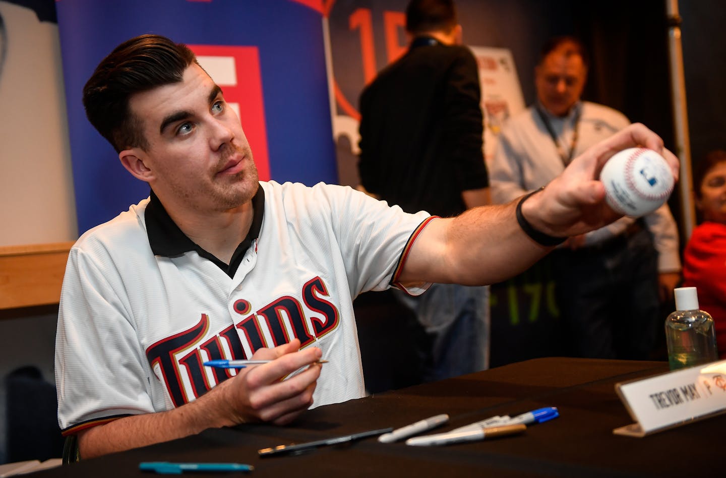 Twins pitcher Trevor May handed a signed baseball back to a fan Saturday at TwinsFest. ] AARON LAVINSKY &#x2022; aaron.lavinsky@startribune.com Twins pitcher Trevor May signed autographs for fans during Twins Fanfest on Friday, Jan. 27, 2017.