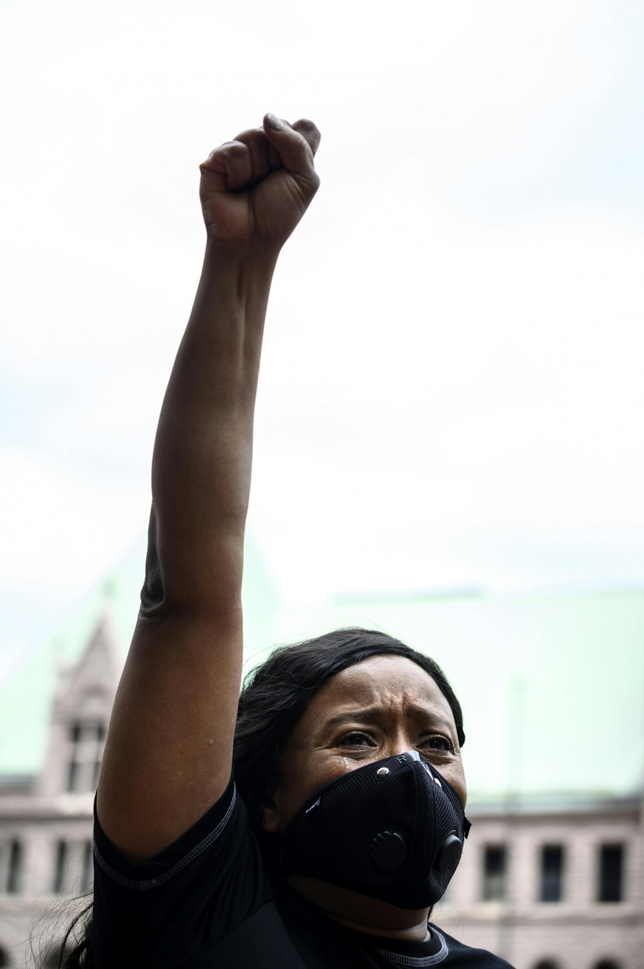 Tears streamed down the face of Felicia Johnson, of St. Paul as she was overcome with grief during the reading of names of people killed by police Saturday outside the Hennepin County Government Center. "I am tired of being sick and tired," said Johnson. "I'm here to stand for truth. I'm here to stand for justice. I'm here to stand for Righteousness."