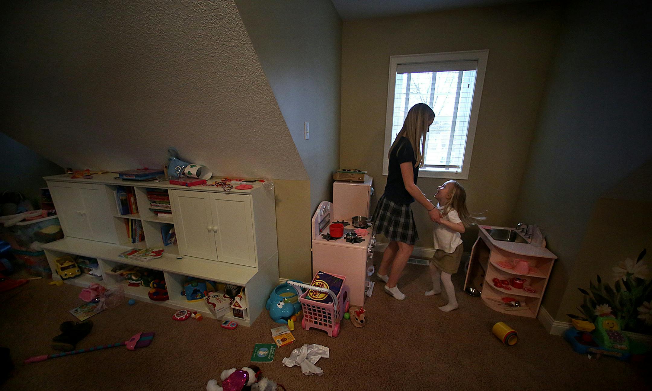 They began as an 8th-grade reading buddy and a budding kindergarten reader, but as the year wraps up at Carondolet Catholic School, Leni Kuhn and Caroline Monchamp have become far greater buddies. Caroline now babysits for Leni where they play house, do art projects and, of course, read. Living just five blocks apart, they're BFFs. ] JIM GEHRZ ‚Ä¢ jgehrz@startribune.com / St. Louis Park, MN / March 21, 2014 / 5:30 PM / BACKGROUND INFORMATION: FOR DUETS COLUMN