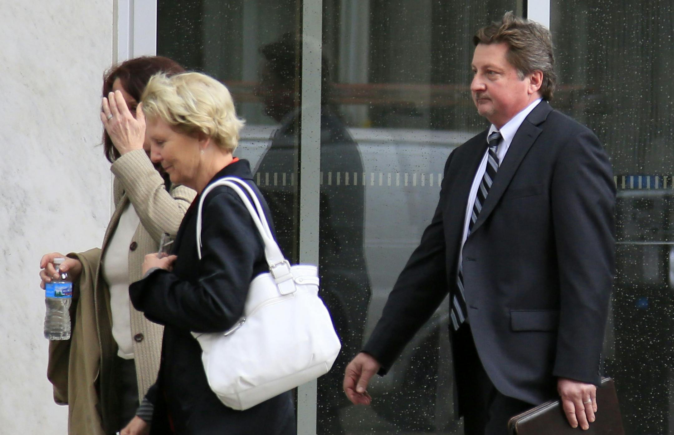 Twin Cities hedge fund manager James Fry was found guilty on all 12 federal charges Wednesday that he misled investors when he when sent their funds to former Wayzata businessman-turned-felon Tom Petters. Here, Fry walks out of court with his wife (Hand on face) after the trial. ] BRIAN PETERSON ‚Ä¢ brianp@startribune.com Minneapolis, MN - 06/10/2013