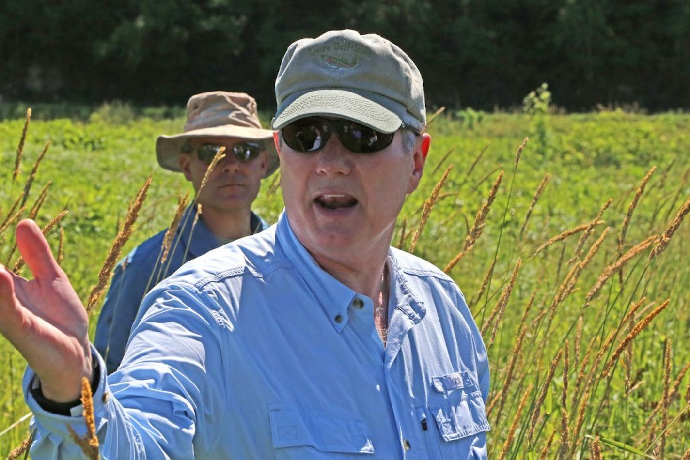 Infectious disease specialist Dr. Michael Osterholm of the University of Minnesota explains his trout stream rehabilitation methods at Prairie Song Farm, his northeastern Iowa retreat. Osterholm has spent many years of work and experimentation to reclaim trout streams on his property.