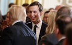 White House senior adviser Jared Kushner shakes hands with President Donald Trump during an event on prison reform in the East Room of the White House