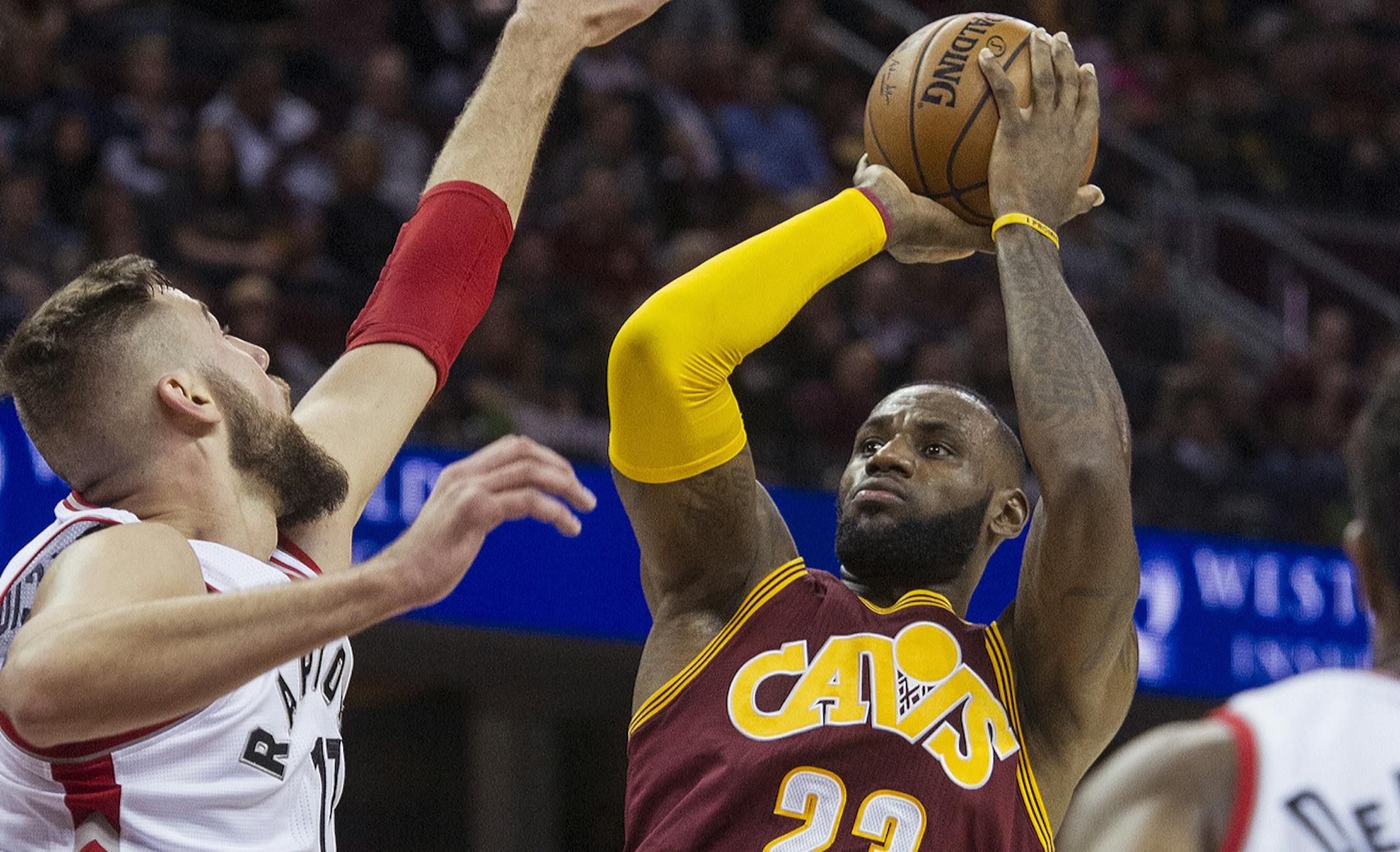 Cleveland Cavaliers' LeBron James (23) shoots over Toronto Raptors' Jonas Valanciunas during the first half of an NBA basketball game in Cleveland, Tuesday, Nov. 15, 2016. The Cavaliers won 121-117. (AP Photo/Phil Long)