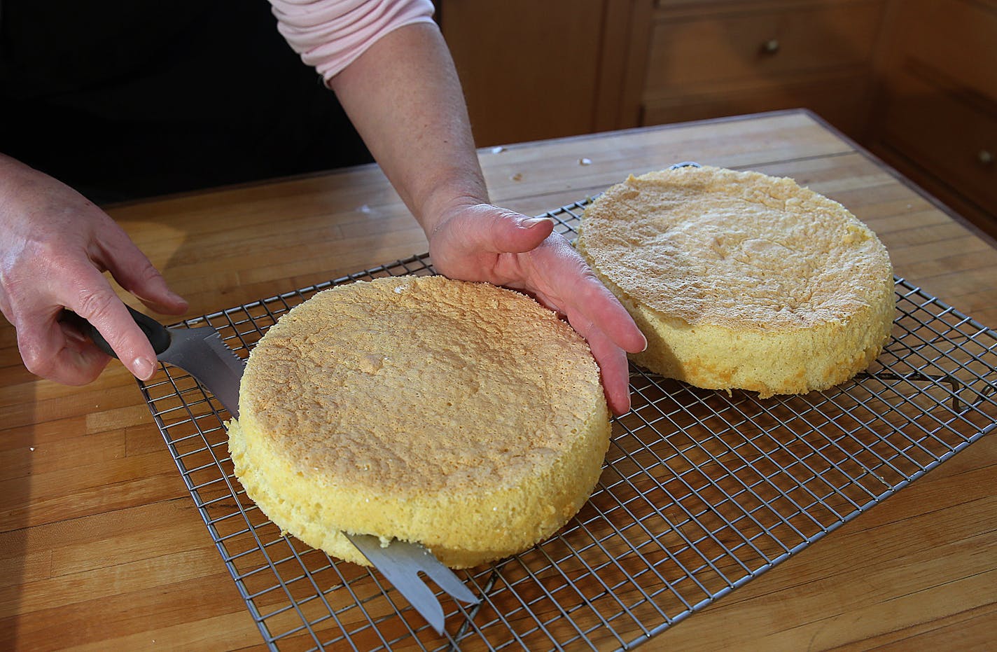 Coconut cake.] JIM GEHRZ &#x201a;&#xc4;&#xa2; jgehrz@startribune.com / Minneapolis, MN / April 4, 2014 / 1:00 PM BACKGROUND INFORMATION: Reporter Kim Ode bakes a coconut cake for Baking Central, complete with step-by-step photos showing the making of batter and custard, assembling and decorating.