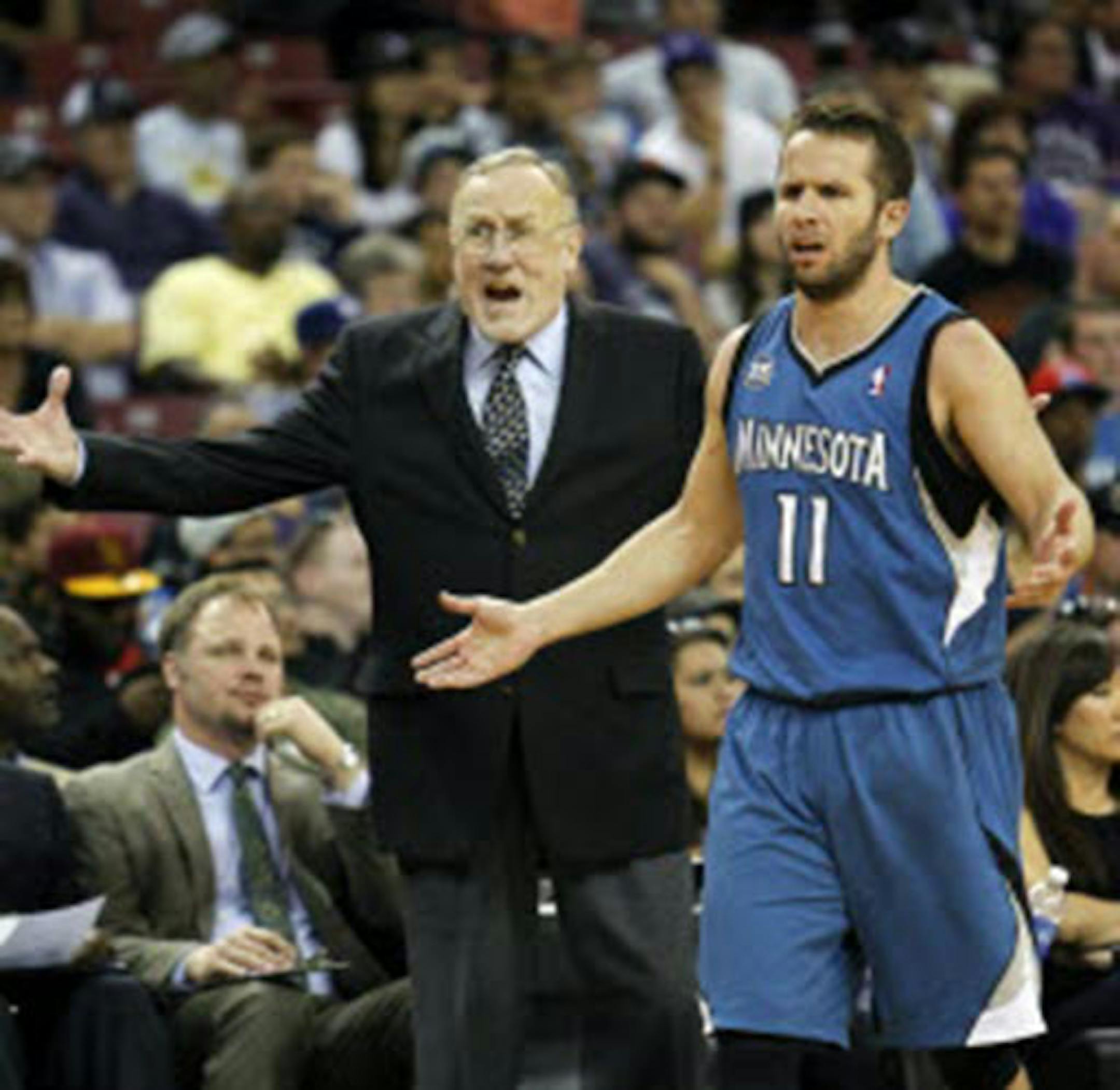 Timberwolves coach Rick Adelman and guard J.J. Barea reacted to an official's call during the second half against Sacramento on Sunday. The Kings won 106-103.