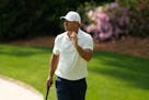 Brooks Koepka waved after putting on the 13th hole Friday during the second round of the Masters.