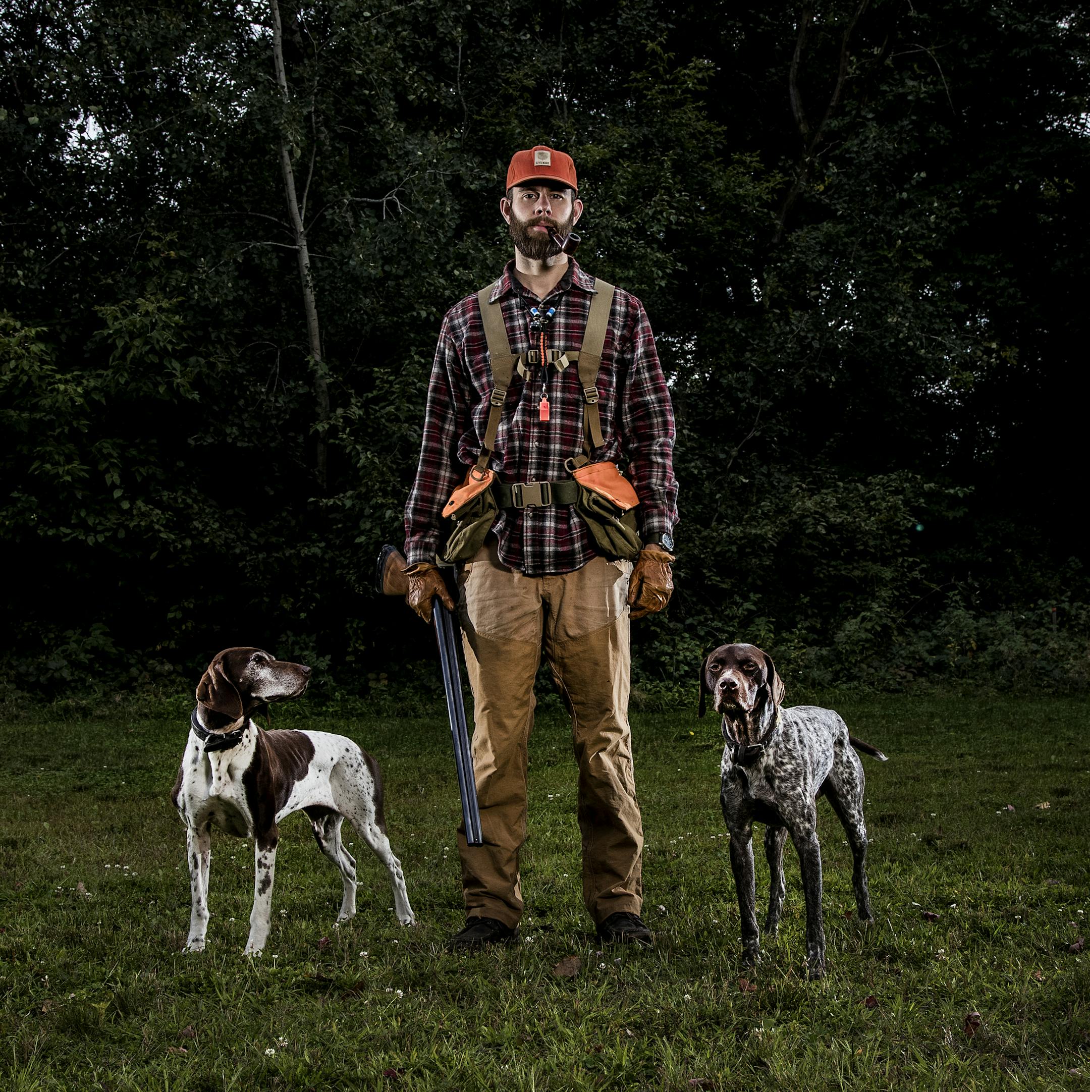 Grouse hunter Garrett Mikrut of Circles Pines with his German shorthaired pointers Stella and Surly. ] CARLOS GONZALEZ ï cgonzalez@startribune.com - September 6, 2017, Circle Pines, MN, Catching up with a grouse hunter, Garrett Mikrut of Circles Pines, and checking on his gear list for this season