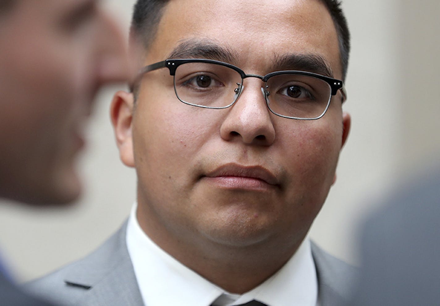 FILE - In this May 30, 2017, file photo, St. Anthony police officer Jeronimo Yanez stands outside the Ramsey County Courthouse while waiting for a ride in St. Paul, Minn. Opening statements are expected to begin Monday, June 5, 2017, in the trial for officer Yanez, who is charged with second-degree manslaughter in the death of Philando Castile during a traffic stop in the St. Paul suburb of Falcon Heights in July 2015. (David Joles/Star Tribune via AP, File)