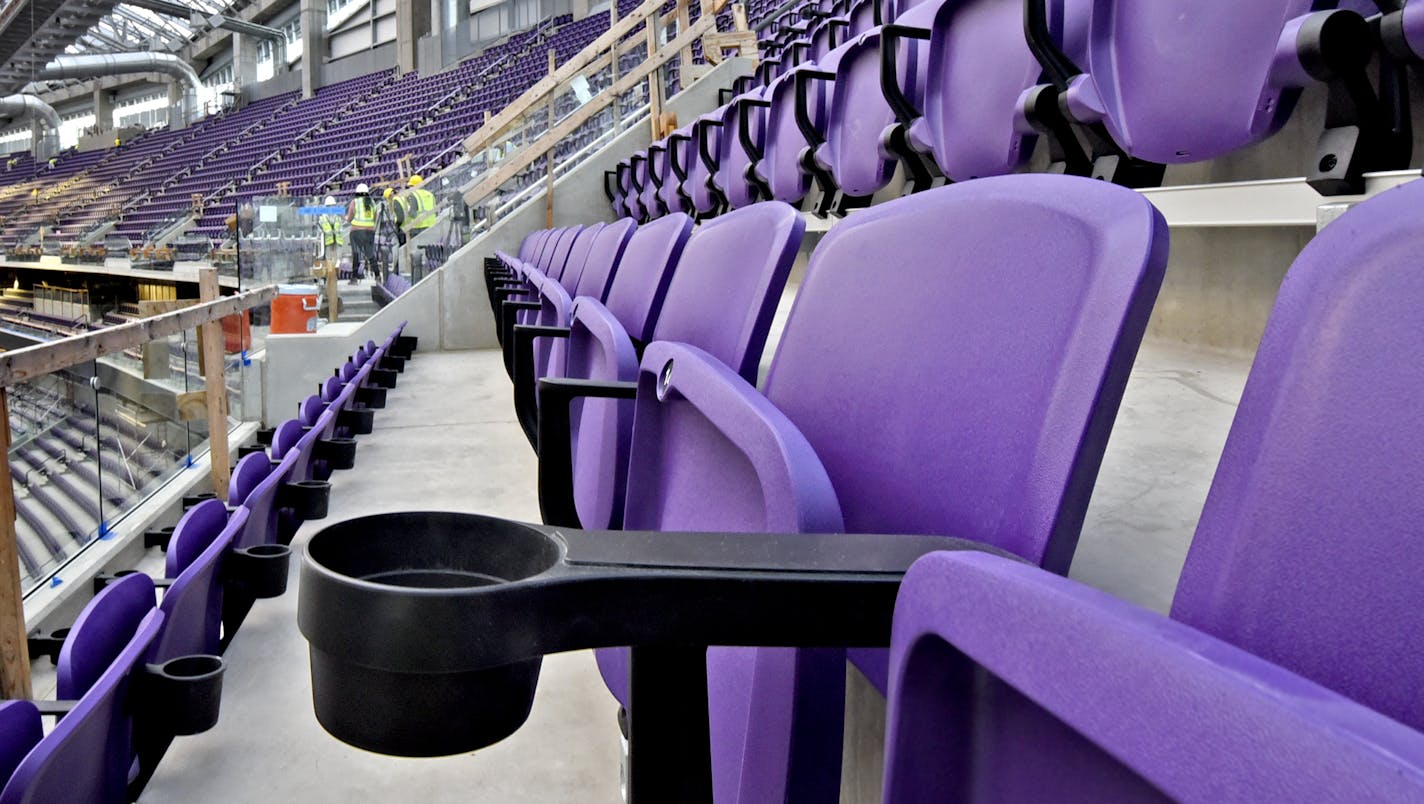 Workers install two rows of seats in section 349 of U.S. Bank Stadium, the new home of the Minnesota Vikings, in Minneapolis, Minn. on Friday March 25, 2016. (Richard Marshall for the Minnesota Vikings) ORG XMIT: rdm new Vikings seats