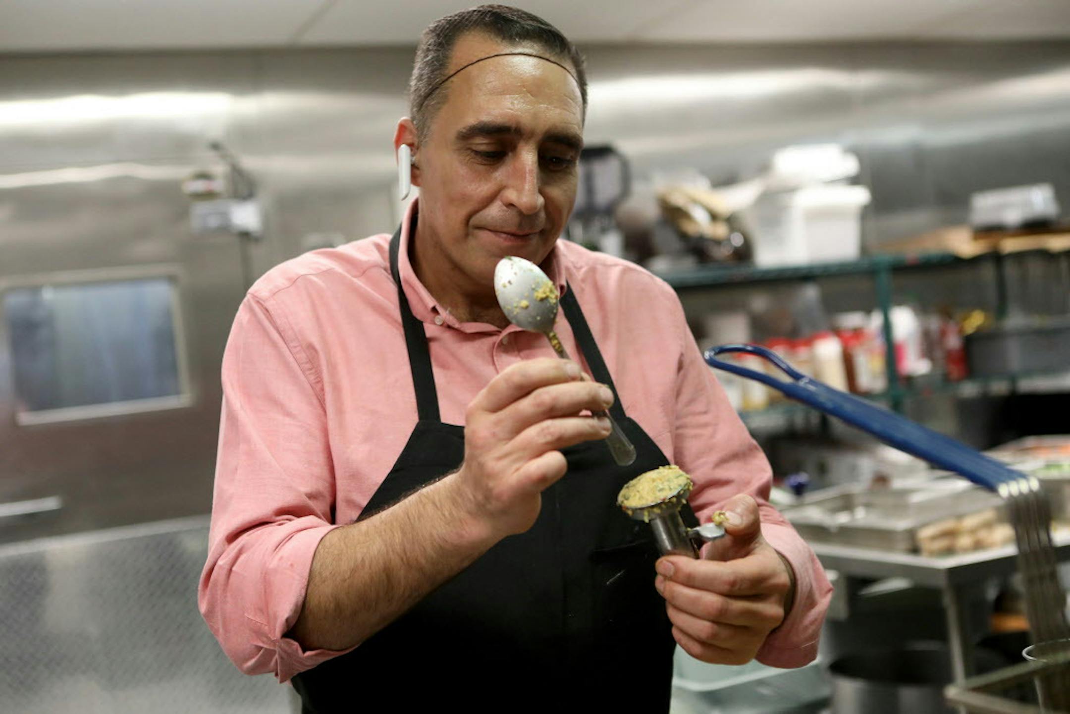 Mohammed Aref Rawas shapes falafels at his food kiosk the Old Damascus Fare on the campus of UC Berkeley in Berkley, Calif., on Wednesday, Oct. 18, 2018. The Rawas family arrived in the United States as refugees in 2015, settling into Oakland to escape the traumas of Syria's civil war. Three years later, the family owns a catering business, Old Damascus Fare, that serves authentic Syrian food.