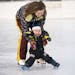 Beth Thomas held her 16-month-old son, Jonathan Foucault, while skating at Duluth Heights Park on Monday.
