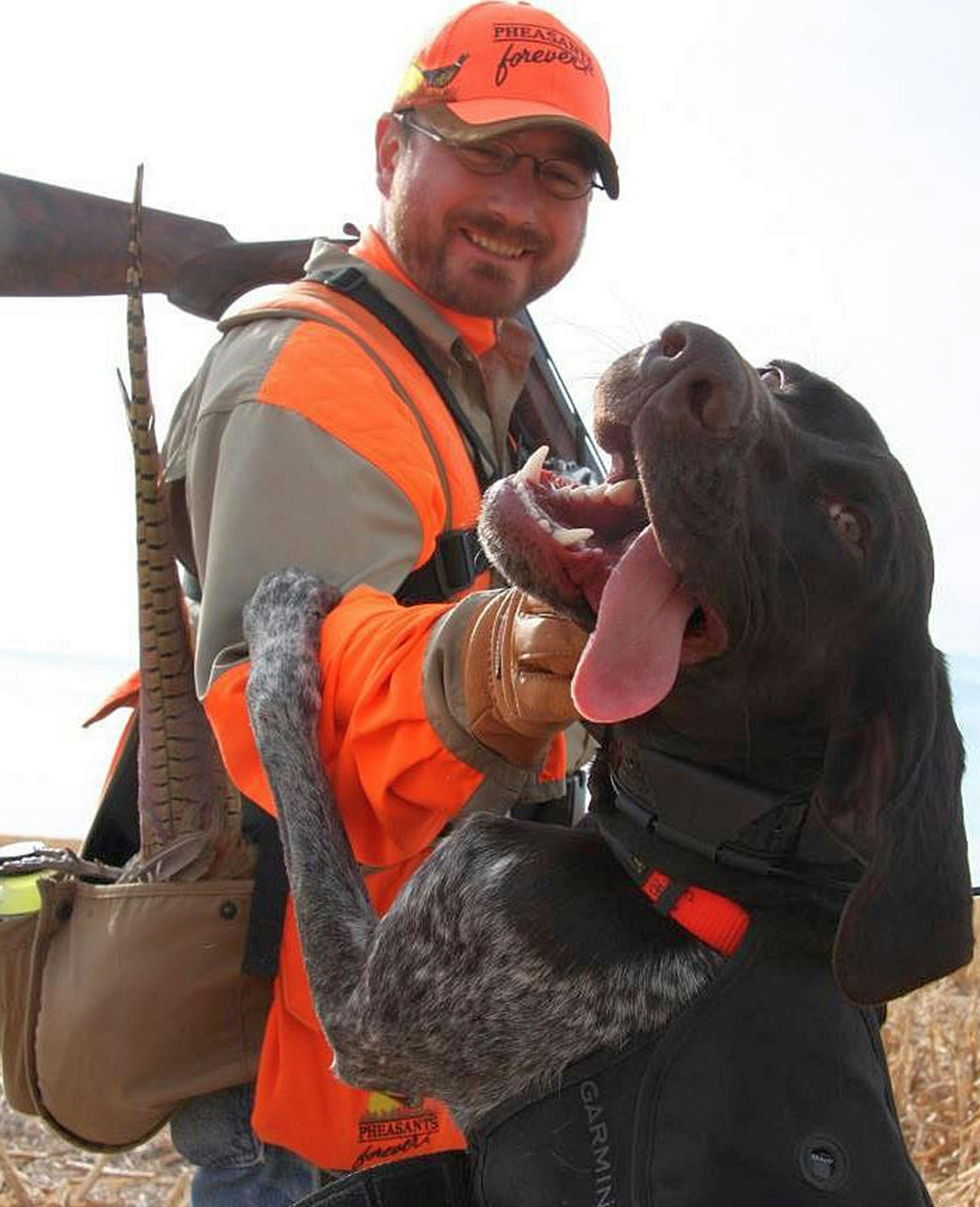 Bob St. Pierre of Hugo with Izzy, his 1½-year-old German shorthaired pointer during a pheasant outing.