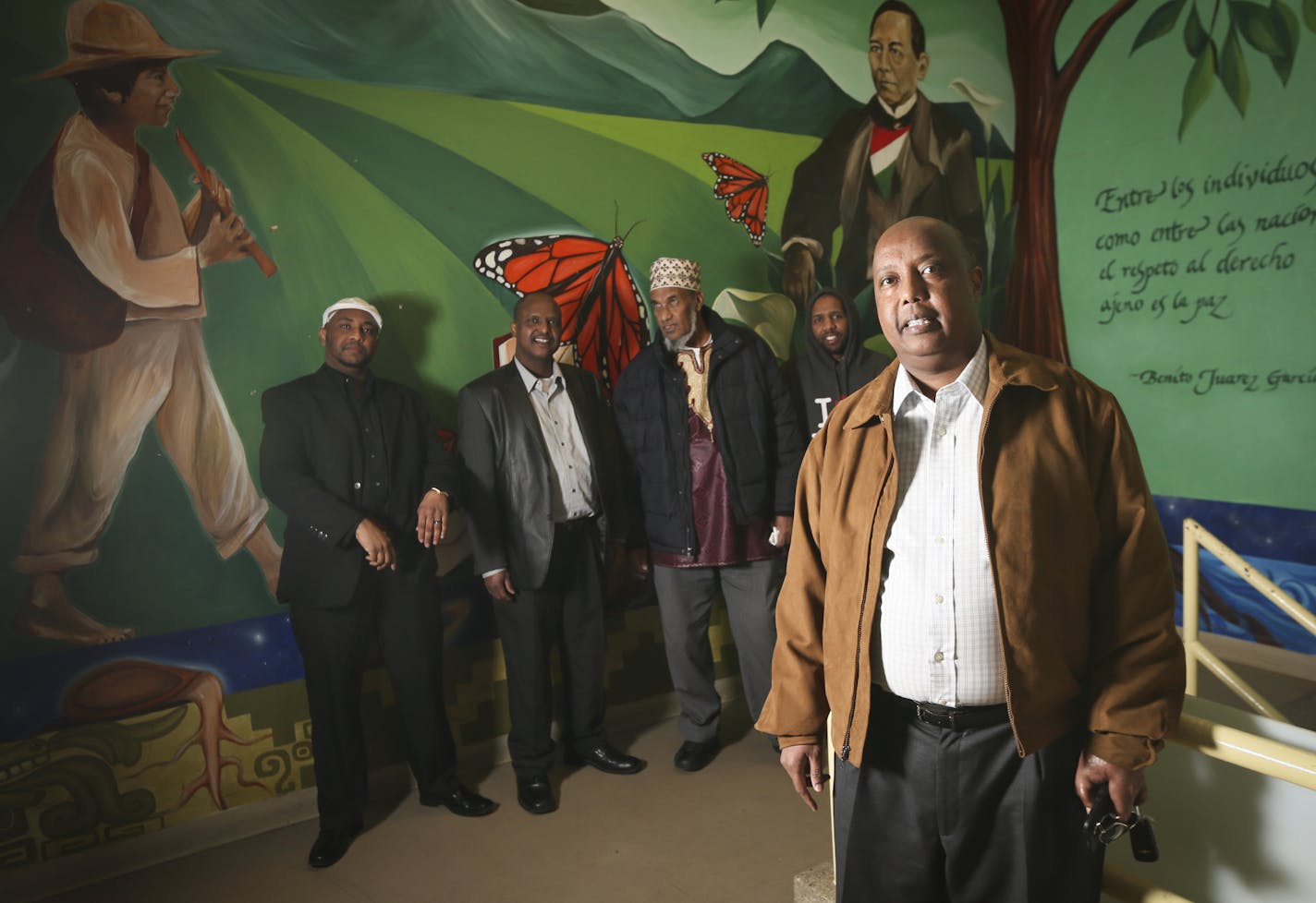 Future owner Khadar Adan, standing with his family, at Plaza Verde on Monday, February 22, 2016, in Minneapolis, Minn. ] RENEE JONES SCHNEIDER &#x2022; reneejones@startribune.com